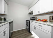 Thumbnail 2 of 16 - Kitchen at Whitcomb Terrace Apartments, Merrillville