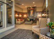 Thumbnail 8 of 22 - Liberty Gateway Apartments, Salt Lake City, Utah, lobby area with a fireplace and a painting above it.