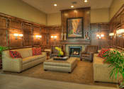 Thumbnail 10 of 22 - Liberty Gateway Apartments, Salt Lake City, Utah, lobby with a fireplace and a painting above it.