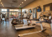 Thumbnail 11 of 22 - Liberty Gateway Apartments, Salt Lake City, Utah, fitness center with treadmills, elliptical machines and other exercise equipment.