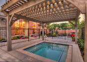 Thumbnail 14 of 22 - Liberty Gateway Apartments, Salt Lake City, Utah, hot tub/spa under a wooden pergola.