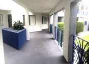 Thumbnail 15 of 24 - outdoor hallway with planter
