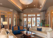 Thumbnail 13 of 49 - a living room filled with furniture and a large window