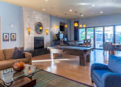 Thumbnail 15 of 49 - a game room with a pool table and a fireplace