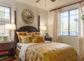 Thumbnail 41 of 49 - a bedroom with a large bed and two windows