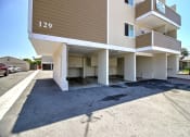 Thumbnail 7 of 31 - a view of the front of an apartment building with a parking lot