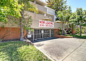 Thumbnail 3 of 30 - A building with a leasing sign on it.