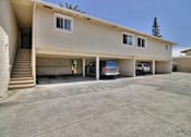 Thumbnail 5 of 37 - A two-story house with a garage and a car parked in it.