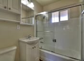 Thumbnail 11 of 22 - a bathroom with a sink and a shower