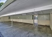 Thumbnail 7 of 22 - A parking garage with concrete floors and walls.