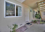 Thumbnail 10 of 21 - the front door of a house with a white door