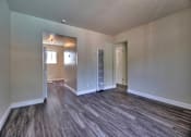 Thumbnail 12 of 21 - the living room and dining room of an empty house