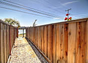 Thumbnail 8 of 26 - a wooden fence with flowers on top of it