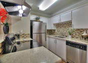 Thumbnail 10 of 80 - Modern Kitchen with Stainless Steel Appliances at Casa Alberta Apartments, Sunnyvale, CA