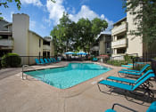 Thumbnail 12 of 23 - pool side with lounges