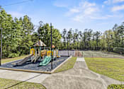 Thumbnail 4 of 47 - A playground with a green slide and a yellow slide.