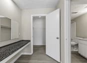 Thumbnail 16 of 47 - A white door is open to a bathroom.