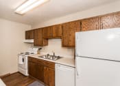 Thumbnail 6 of 12 - Grand Forks Kremer Apartments. A kitchen with white appliances