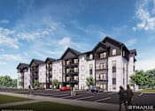 Thumbnail 1 of 12 - A modern apartment complex with a parking lot in front.