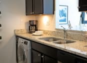 Thumbnail 14 of 46 - Stainless Steel Sink With Faucet In Kitchen at Gramercy on Garfield, Cincinnati, OH