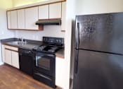 Thumbnail 17 of 32 - Kitchen With Black Appliances at The Mount Royal, Maryland