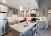 Thumbnail 10 of 29 - Updated Kitchen Pine Lane Estates Apartments in Lansing near Eastwood Towne Center