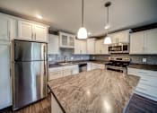 Thumbnail 8 of 29 - Beautiful White Cabinets Kitchen in Lansing Apartments