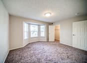 Thumbnail 18 of 29 - Carpeted Bedroom with Bay Window