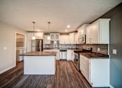 Thumbnail 4 of 29 - Kitchen at Lansing Apartments | Pine Lane Estates Apartments in Lansing, Michigan