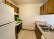 Thumbnail 6 of 18 - Kitchen at Sycamore Apartments in Holt, MI