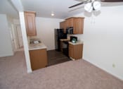 Thumbnail 11 of 18 - Kitchen at Whispering Pines Apartments in Holland, Michigan
