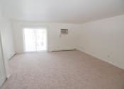 Thumbnail 15 of 18 - Living room at Whispering Pines Apartments in Holland, Michigan