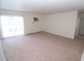 Thumbnail 16 of 18 - Living room at Whispering Pines Apartments in Holland, Michigan