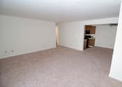Thumbnail 18 of 18 - Living room at Whispering Pines Apartments in Holland, Michigan