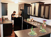 Thumbnail 2 of 8 - Spacious Kitchen and Living room in East Lansing Apartments near Michigan State University | Americana Apartments