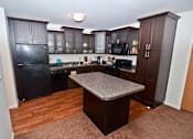 Thumbnail 3 of 8 - Spacious Kitchen and Living room in East Lansing Apartments near Michigan State University | Americana Apartments