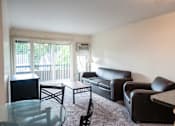 Thumbnail 4 of 8 - Spacious Living room in East Lansing Apartments near Michigan State University | Americana Apartments