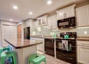 Thumbnail 4 of 30 - Spacious Kitchen at Berrytree Apartments in East Lansing Mi | Near Michigan State University