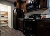 Thumbnail 5 of 20 - Spacious Kitchen in East Lansing Apartments near Michigan State University | Burnt Tree