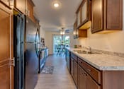 Thumbnail 1 of 22 - Spacious Kitchen in East Lansing Apartments near Michigan State University | Carriage Hill East
