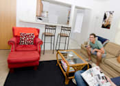 Thumbnail 11 of 11 - Spacious Living room in East Lansing Apartments near Michigan State University | DTN Houses