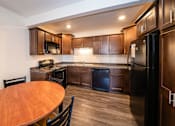 Thumbnail 2 of 10 - Spacious Kitchen in East Lansing Apartments near Michigan State University | Eden Roc