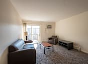Thumbnail 3 of 10 - Spacious Living room in East Lansing Apartments near Michigan State University | Eden Roc