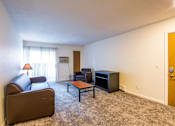 Thumbnail 3 of 9 - Spacious Living room in East Lansing Apartments near Michigan State University |Haslett Arms