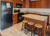Thumbnail 14 of 19 - Spacious Kitchen in East Lansing Apartments near Michigan State University | River Walk