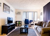 Thumbnail 2 of 10 - Spacious Living room in East Lansing Apartments near Michigan State University | Stoneridge