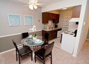 Thumbnail 3 of 9 - Dining room at at Summerhill Estates Apartments in Lansing, MI