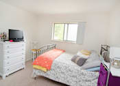 Thumbnail 4 of 9 - Spacious bedrooms in East Lansing Apartments near Michigan State University | Valley Forge