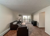 Thumbnail 7 of 15 - Spacious Living room in East Lansing Apartments near Michigan State University | Waters Edge