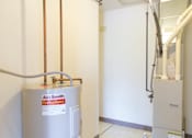 Thumbnail 7 of 19 - A.L. Smith water heater in a room.